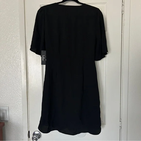 Lulu’s with this kiss black flutter sleeve mini dress - Picture 7 of 10